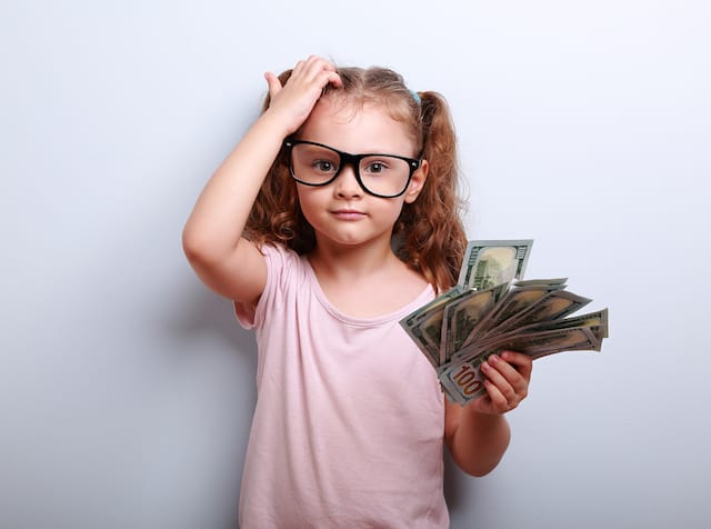 basic life skills for kids- girl with money