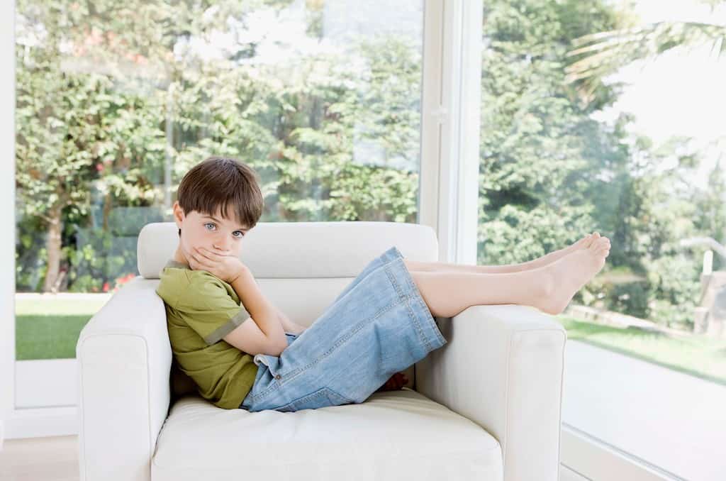 Boy sitting alone- how to stop sibling rivalry