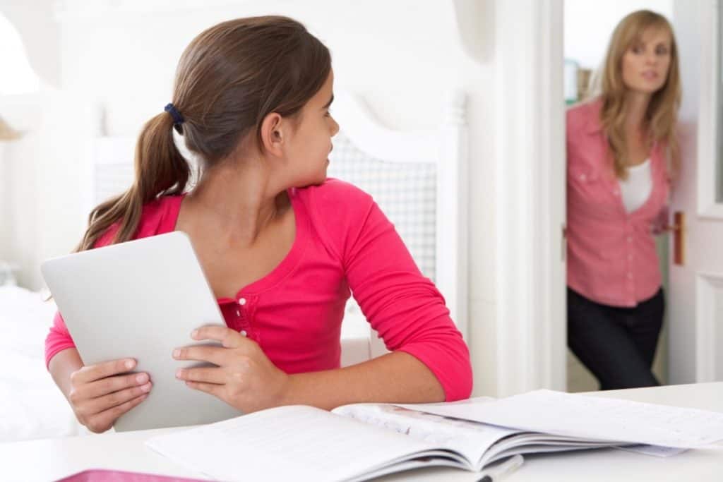 Canva - Mother Catches Daughter Using Tablet 