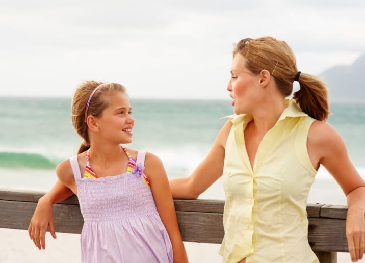 mom speaking encouraging words to daughter