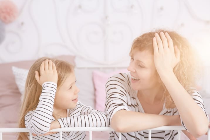 Mom talking to daughter in a happy mood