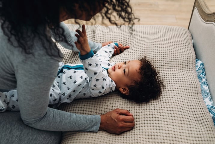 Toddler playing with mom