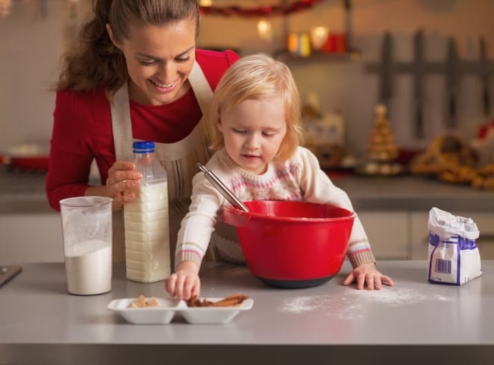 Daughter helping mom to make cookies. One of the bad habits of mom is not asking for help