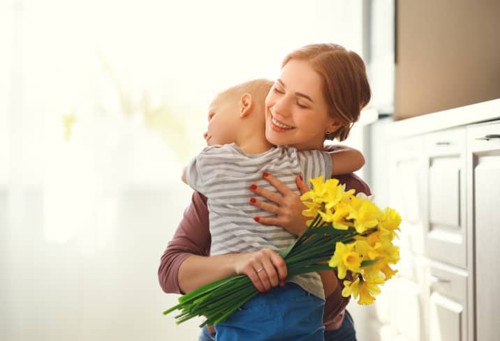 woman hugging her son