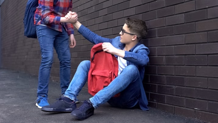 boy helping another boy- why we should let boys cry