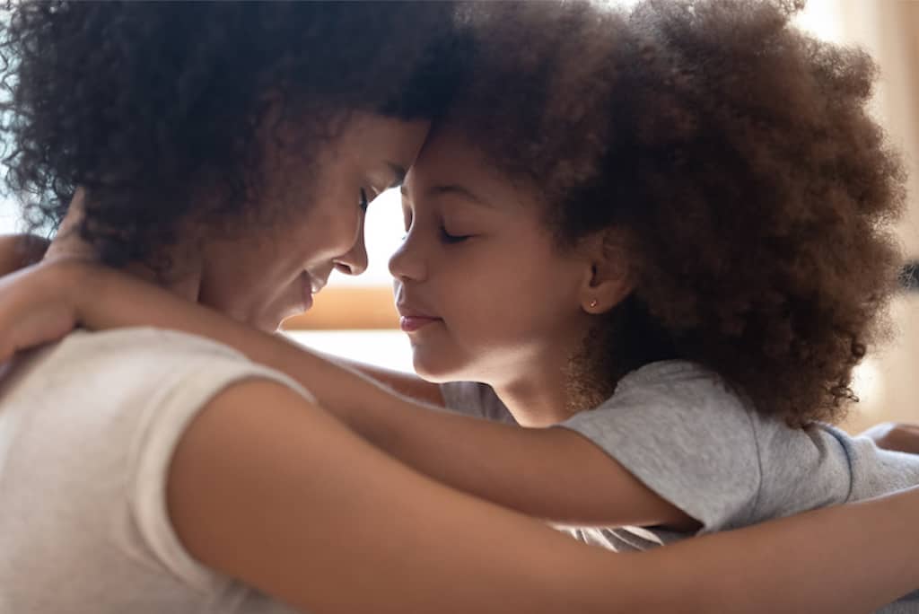 mom hugging a girl