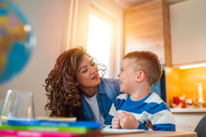 Mom and son smiling at each other