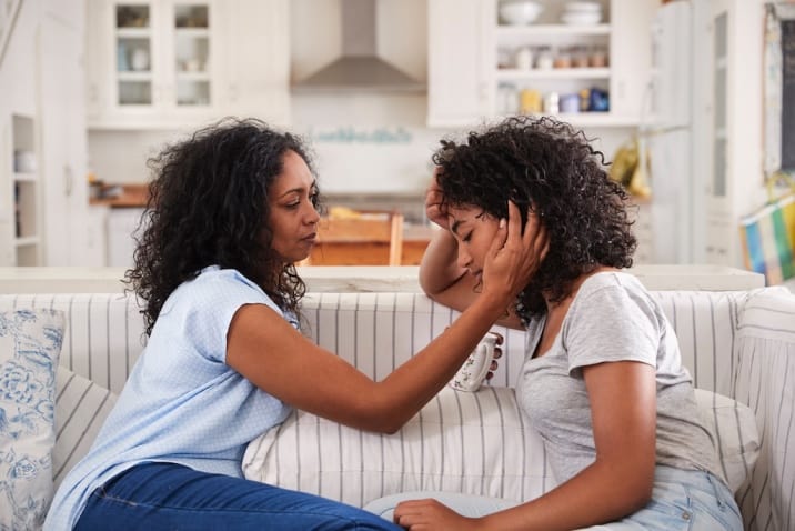 a mom consoling her daughter