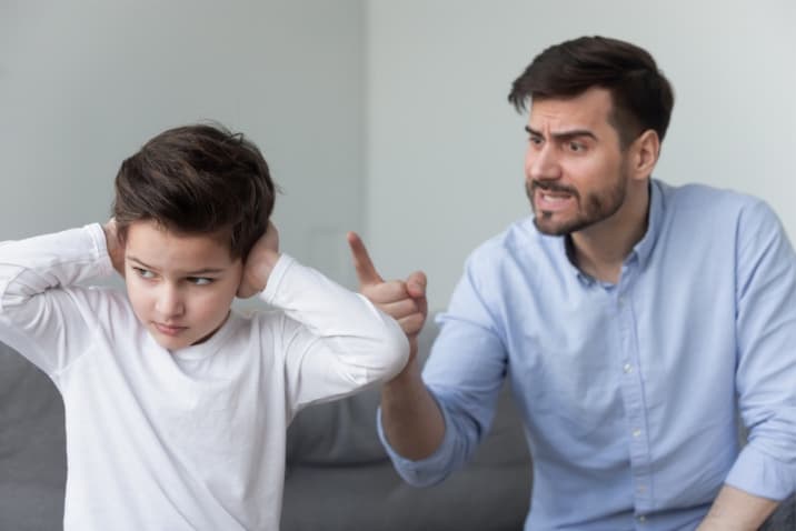 dad lecturing son and son is not interested