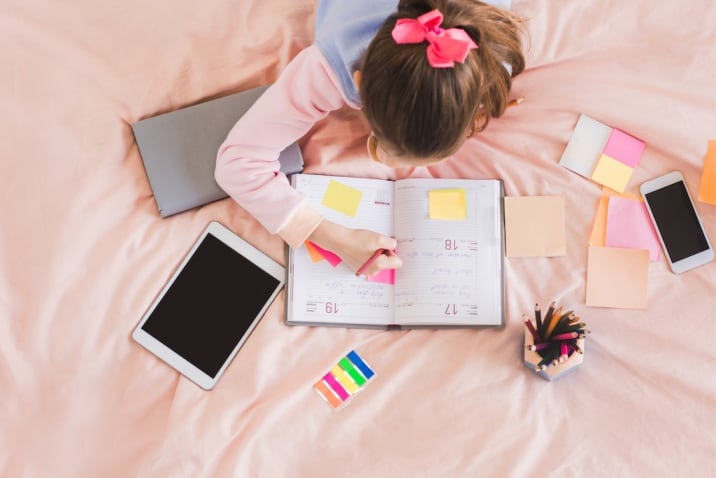 girl writing her daily routine