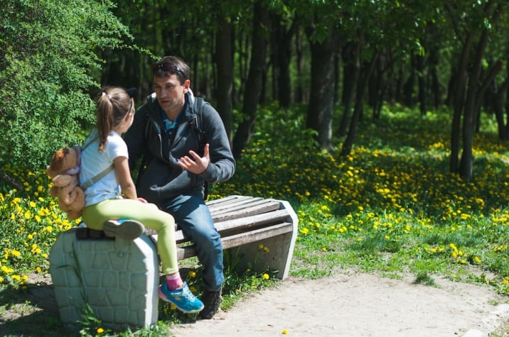 a father talking to his daughter