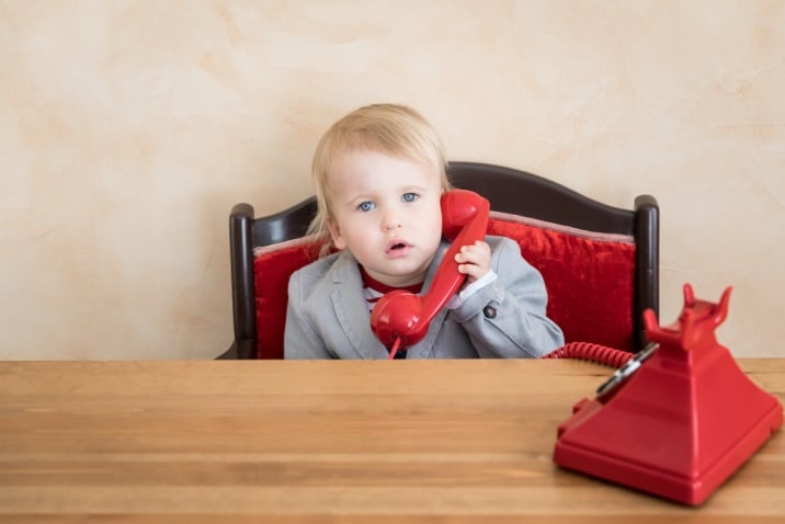 a child speaking on telephone-list of basic good manners for kids