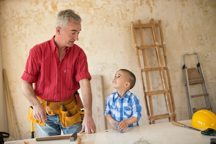 a father doing woodwork with son-list of basic good manners for kids