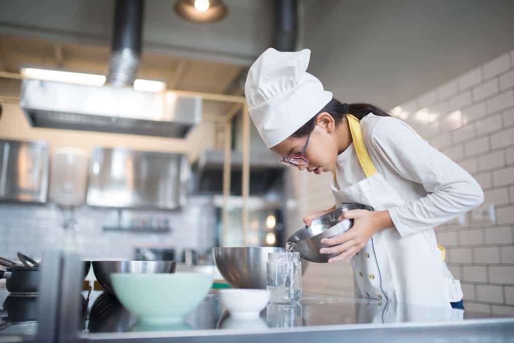 A girl baking a dish