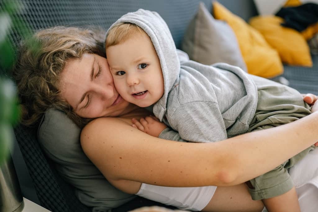 a mom hugging her son(how to parent a sensitive child)