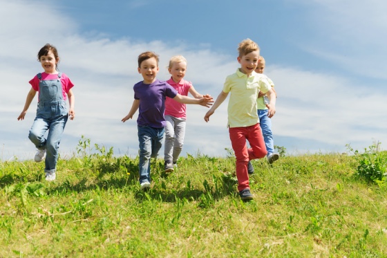 how to raise respectful kids - a group of kids are running happily