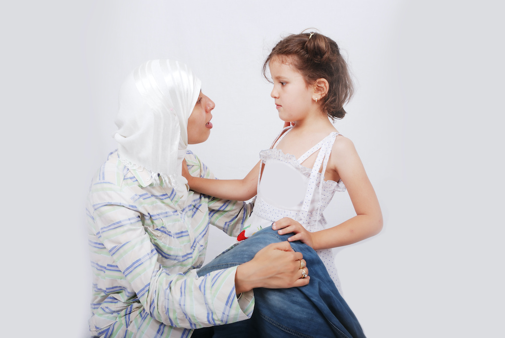 a girl talking seriously with her mother