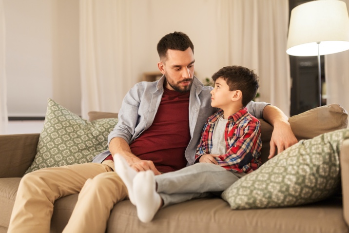 a boy talking with father