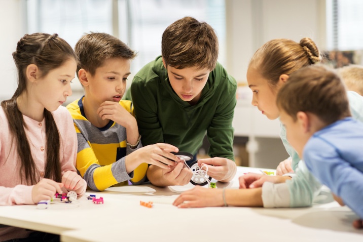 a group of kids working on a project