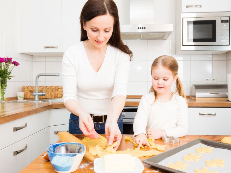 mother and tween daughter baking together - mother daughter activity idea