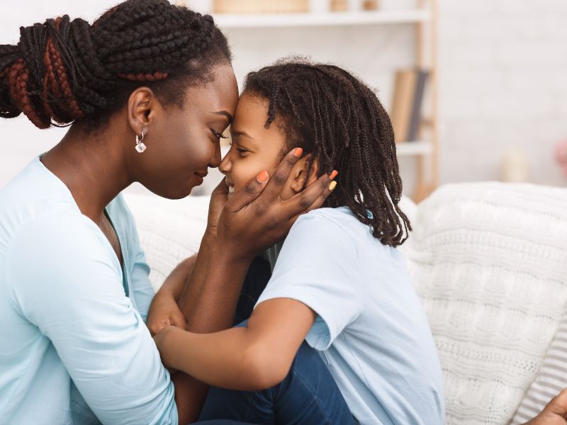 a mother hugging her child - affection is important to discipline strong-willed kids