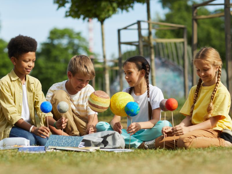 kids doing a project in a natural environment-nature play for kids