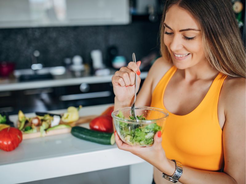 a woman is eating healthy