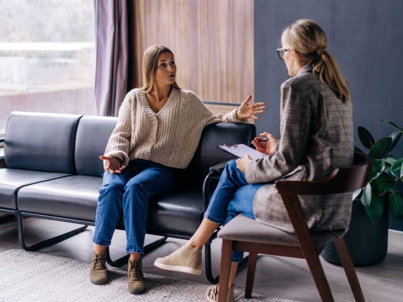 a mom is talking to a therapist